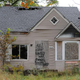 An abandoned home seen Sept. 30, 2013, in Detroit, is decorated with a piece of fencing and graffiti that declares, “All I ever wanted was a white picket fence.”
MIRA OBERMAN/AFP/Getty Images